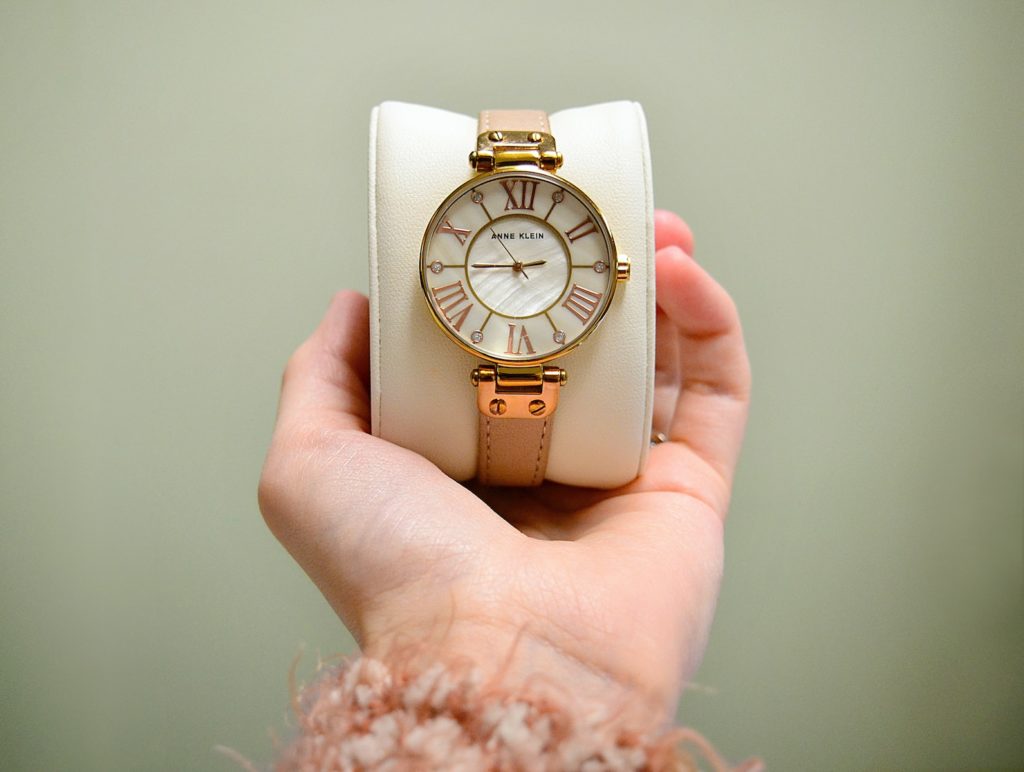 gold and white analog watch