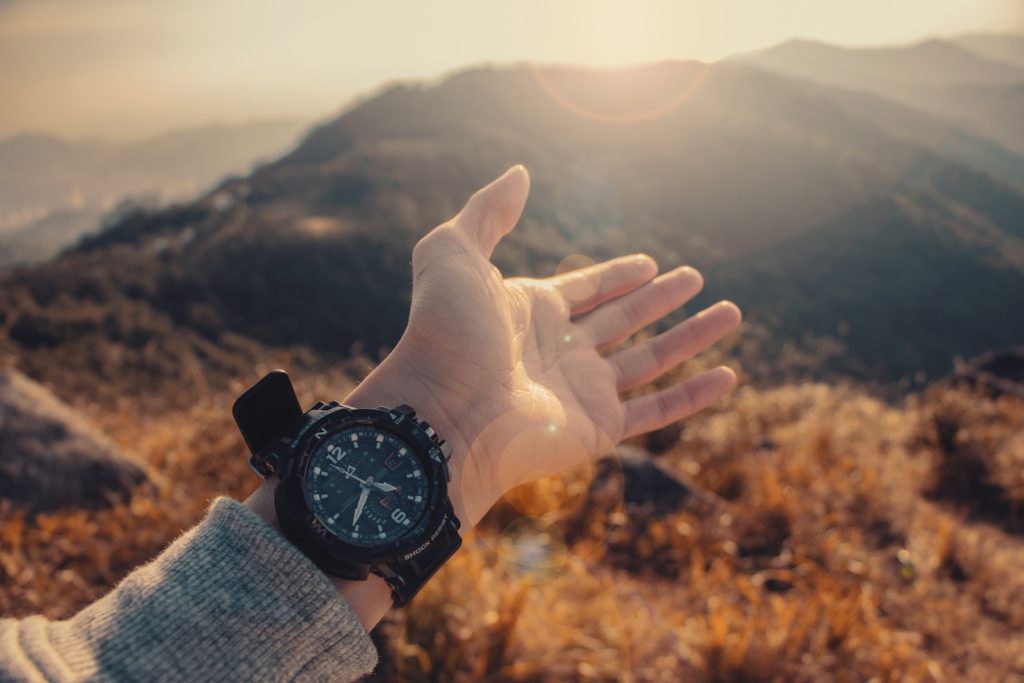 person wearing watch bokeh photography